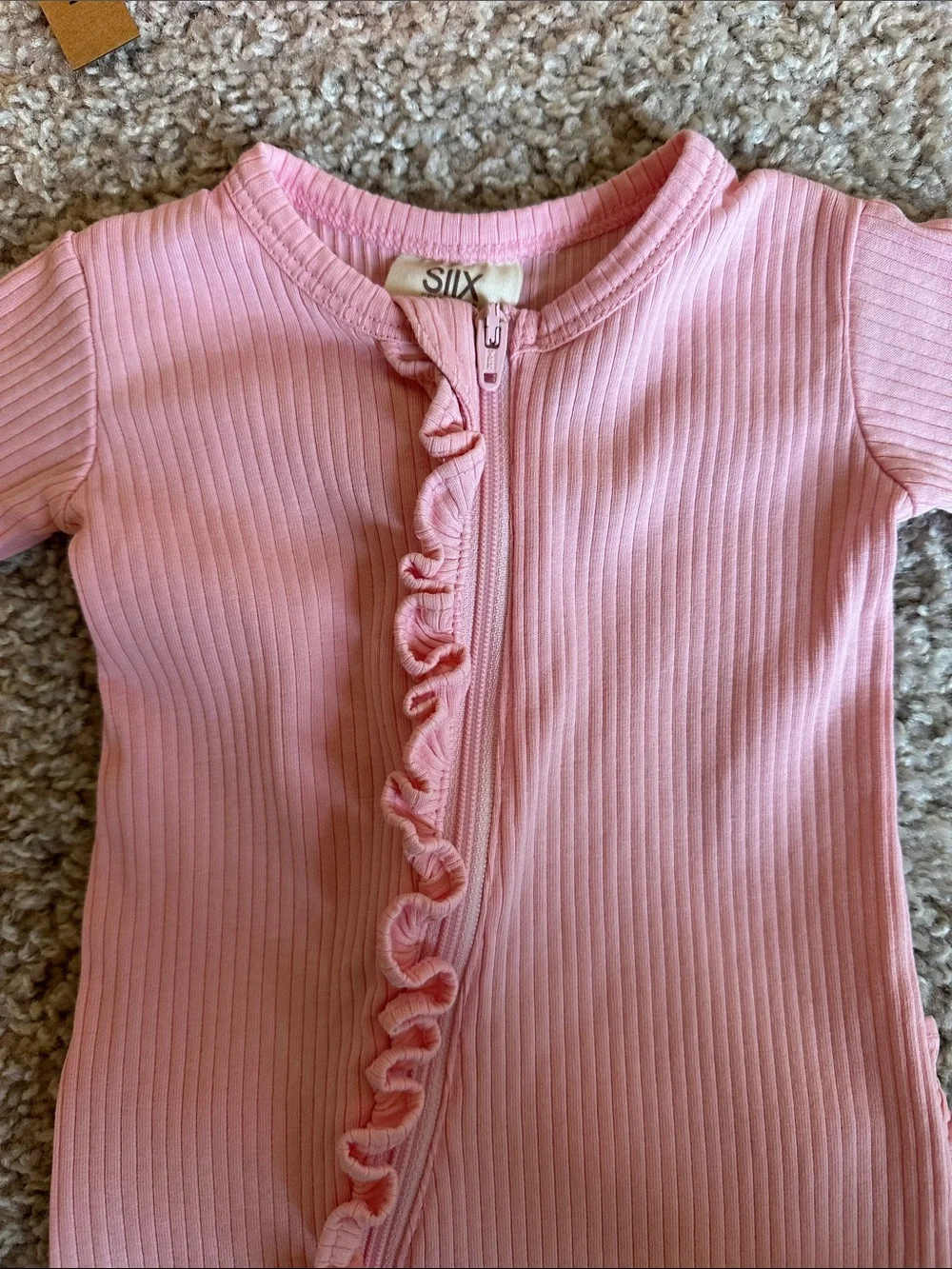 Pink organic ribbed frill zip footie with matching headband
